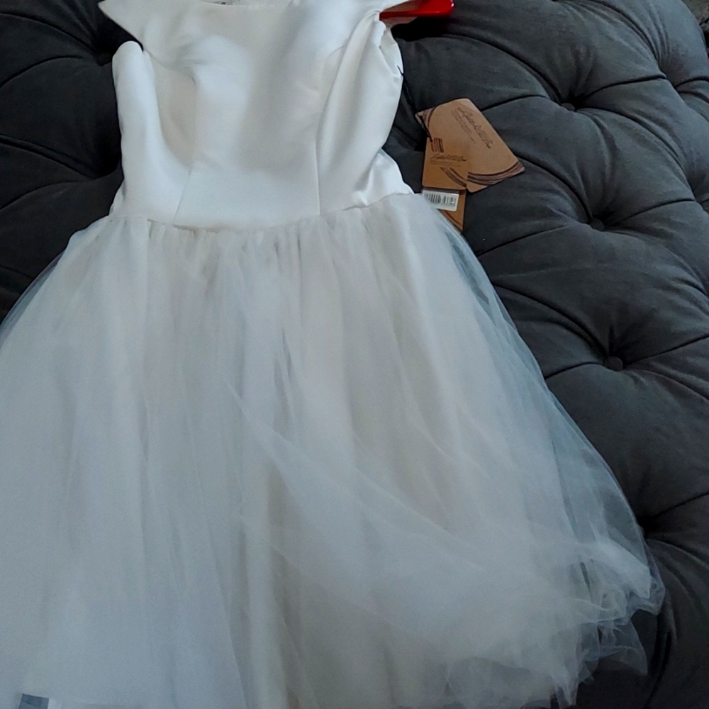 Brand New Ivory Colored Wedding  Dress size 6 with tags